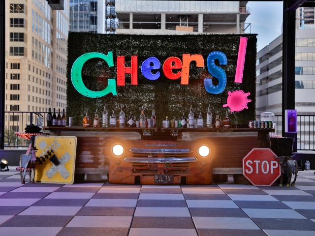 Bar set up with LED Cheers sign.