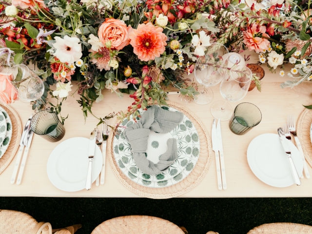 Front view of place setting with white and green accents.