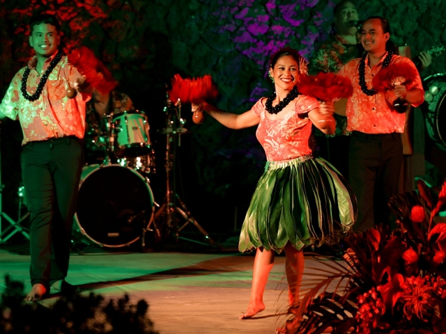 Group of people performing on stage for presidents club final night.