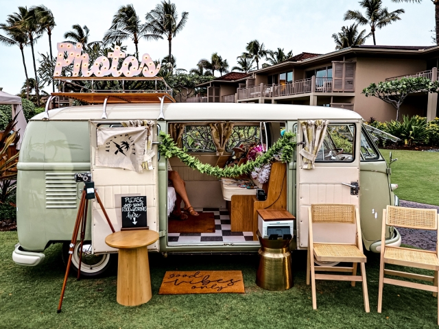 A vintage bus at welcome party with chairs and photo opportunity.