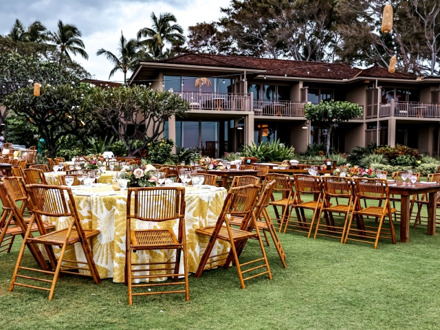 A view of the welcome party with round table and chairs at Four Seasons in Hawaii.