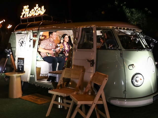 Vintage bus at night at event with photo opportunities.