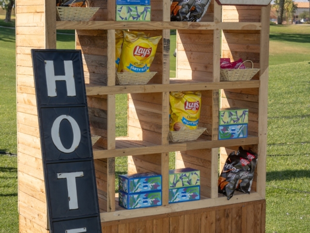 A display filled with snacks at an outdoor event.