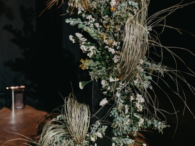 Green floral floor display at wedding