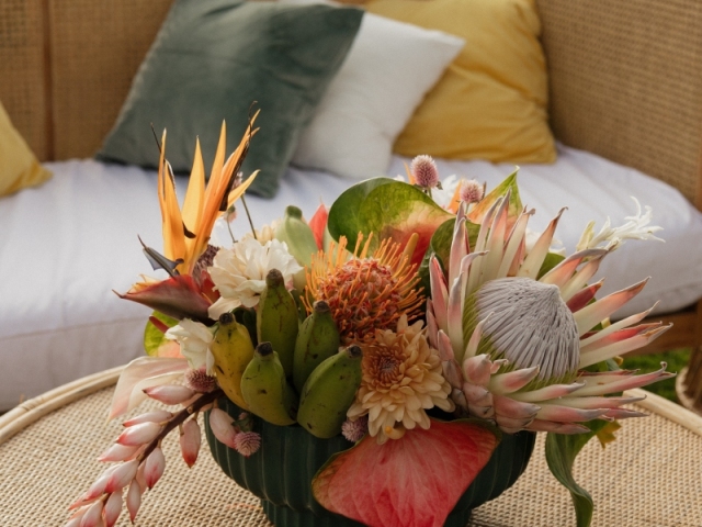 A tropical centerpiece including bananas and unique plants.