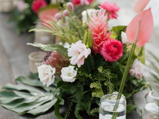 Close up of Hawaiian floral centerpiece with tropical flowers.