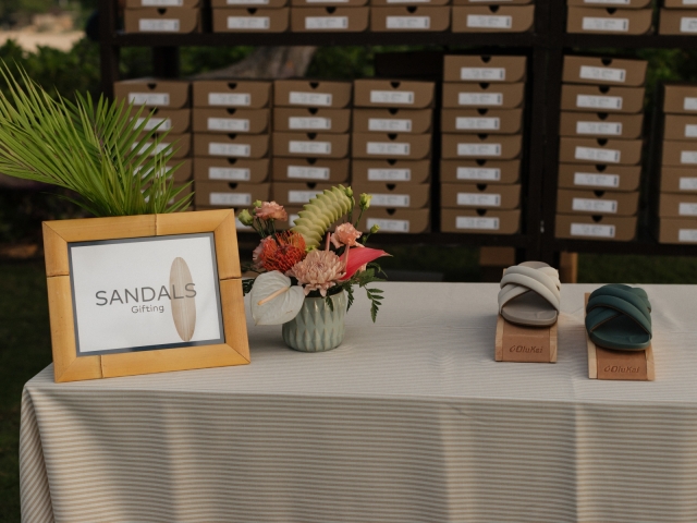 A table featuring sandals for an influencer event.